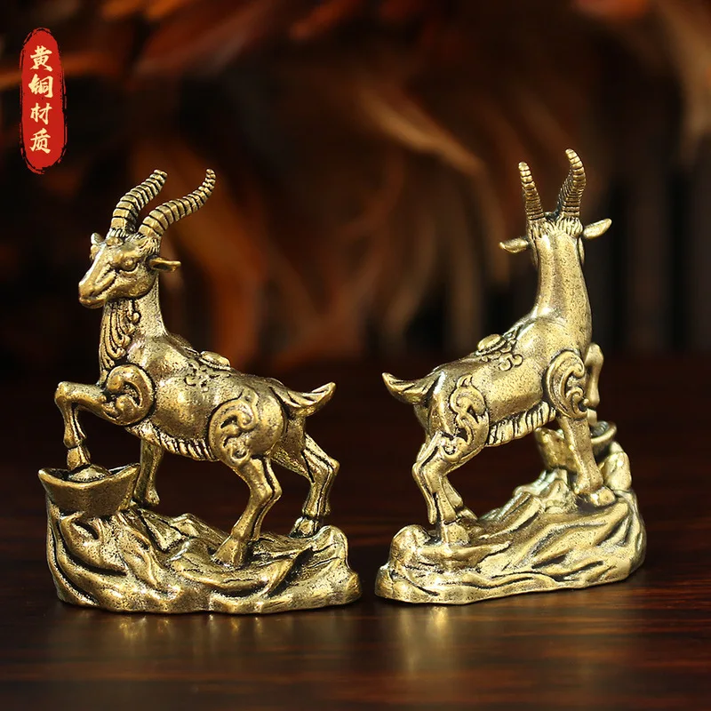 Brass figurine, a creative and vintage-style decorative piece featuring a stepping on a gold ingot, a copper ram ornamen