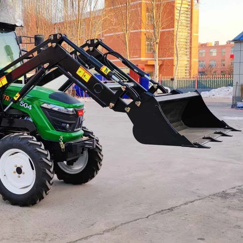 Loader bucket installed in front of tractor