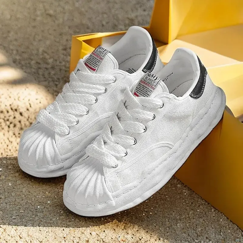 Eenvoudige en sfeervolle leren canvasschoenen en veelzijdige, ademende, comfortabele casual sportschoenen