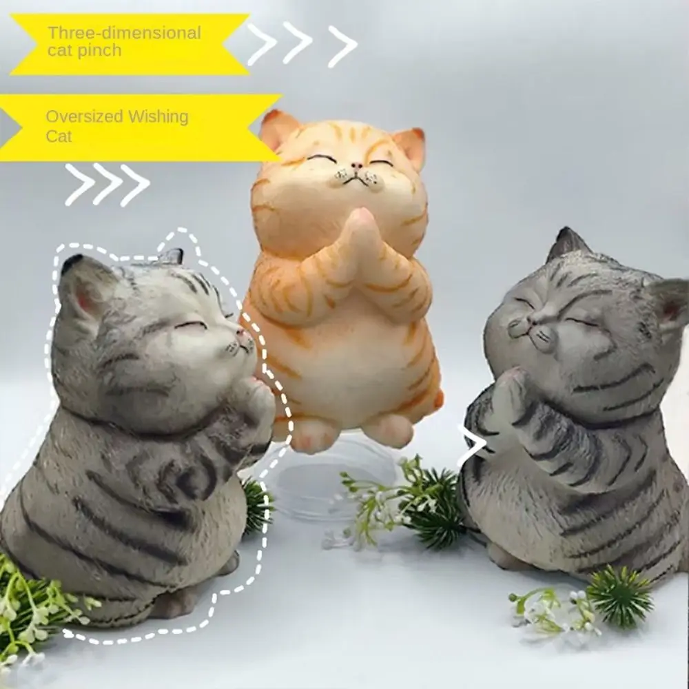 ゆっくり戻る祈り猫のぬいぐるみ、大きな猫の絞り玩具、漫画風動物の柔らかい猫型の絞り玩具、大きなカラフルな人工絞り玩具、感覚玩具