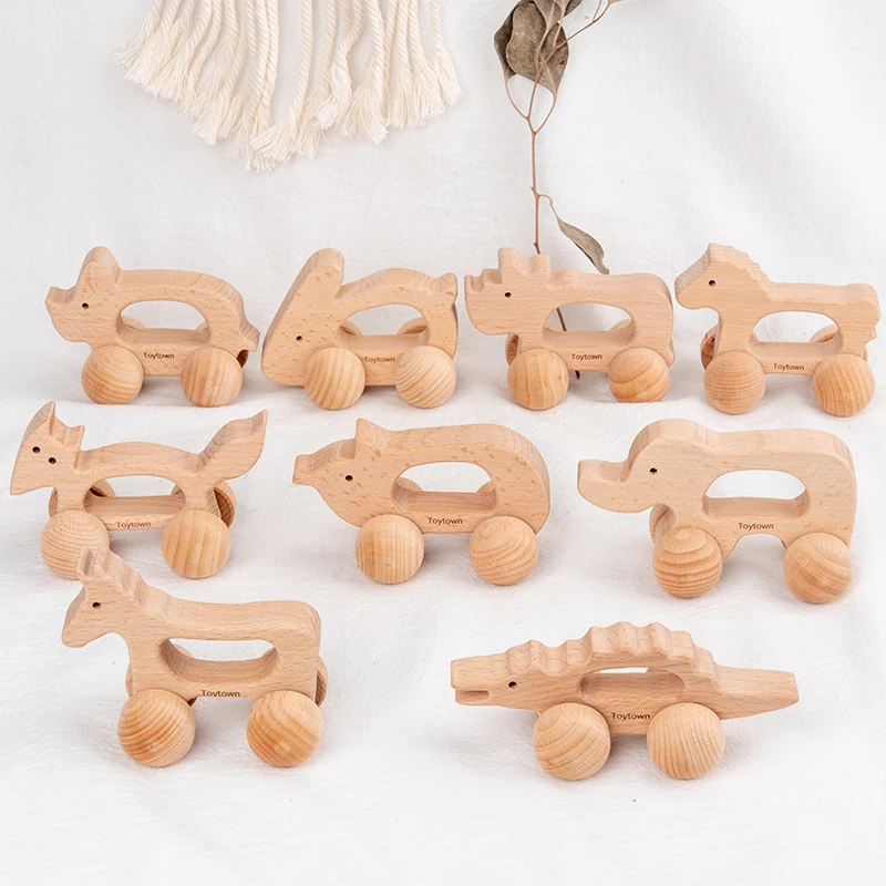 Set di giocattoli a spinta per animali in legno da nove pezzi con coccodrillo, coniglio e altri disegni di animali I bambini hanno esploderà spingendo il c