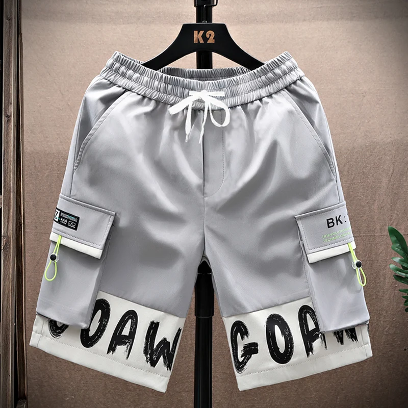 ملابس العمل غير الرسمية orts الرجال الصيف فضفاض مستقيم الساق خمسة أرباع طول العلامة التجارية العصرية في سن المراهقة بناطيل الشواطئ ألياف البوليستر