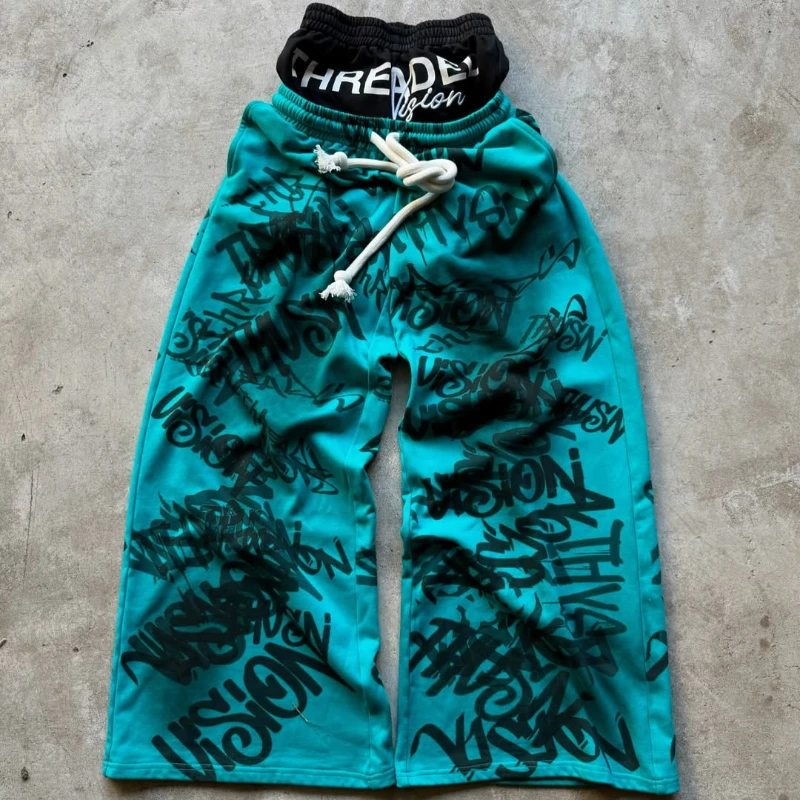 Los Pantalones anchos de doble cintura están de moda, vanguardistas, superpersonalizados y falsos de dos piezas con patrón fluorescente