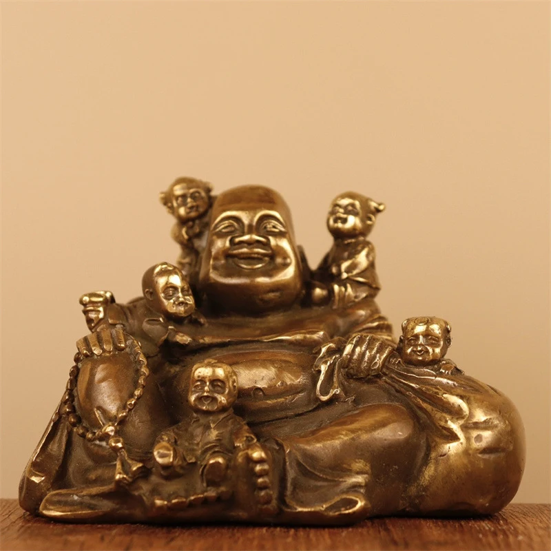 Brass ornament in copper color, multi-figured , Laughing Maitreya Buddha, symbolizing fertility and prospe