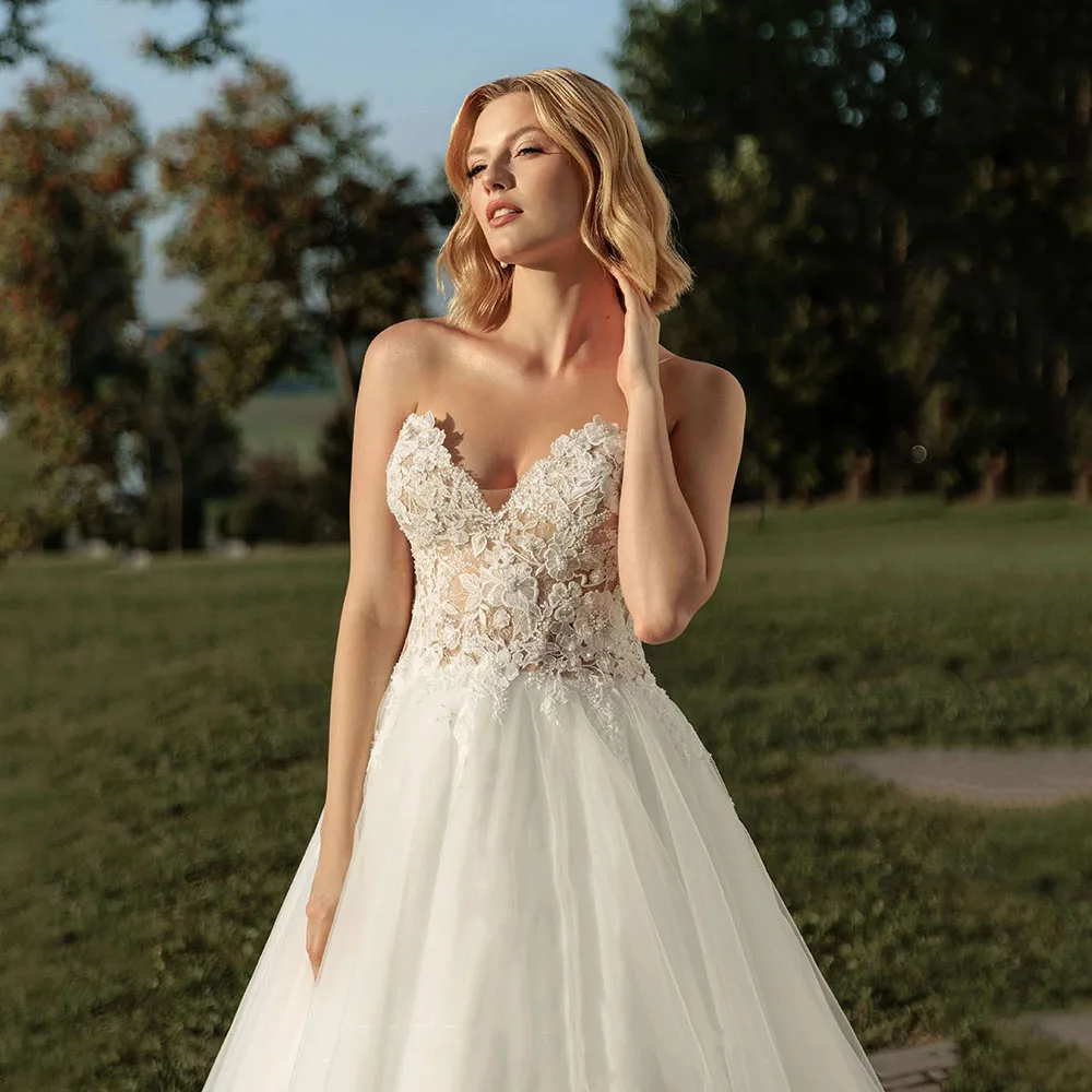 

Customized 2026 V Neck Bride Gown Lace Appliques Tulle A-Line Bridal Dresses Sleeveless Backless Plus Size Wedding Dresses