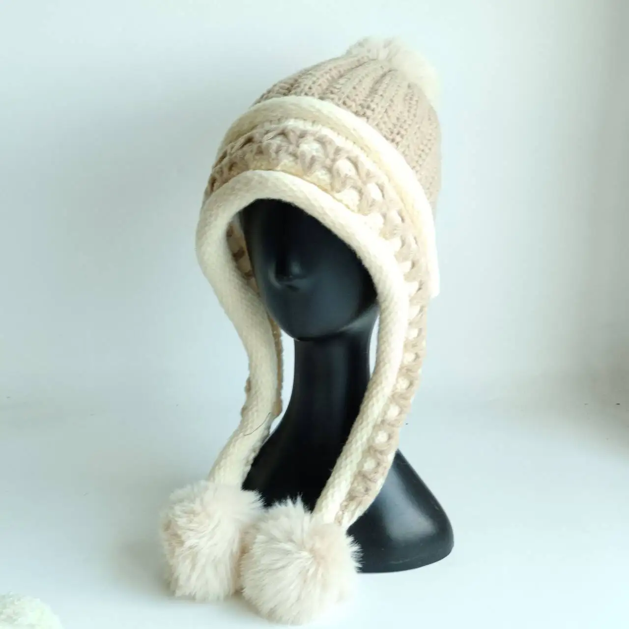 Women's winter knitted beanie with ear flaps and faux fur pom-poms, warm and cozy, suitable for women and girls to wear outdoors