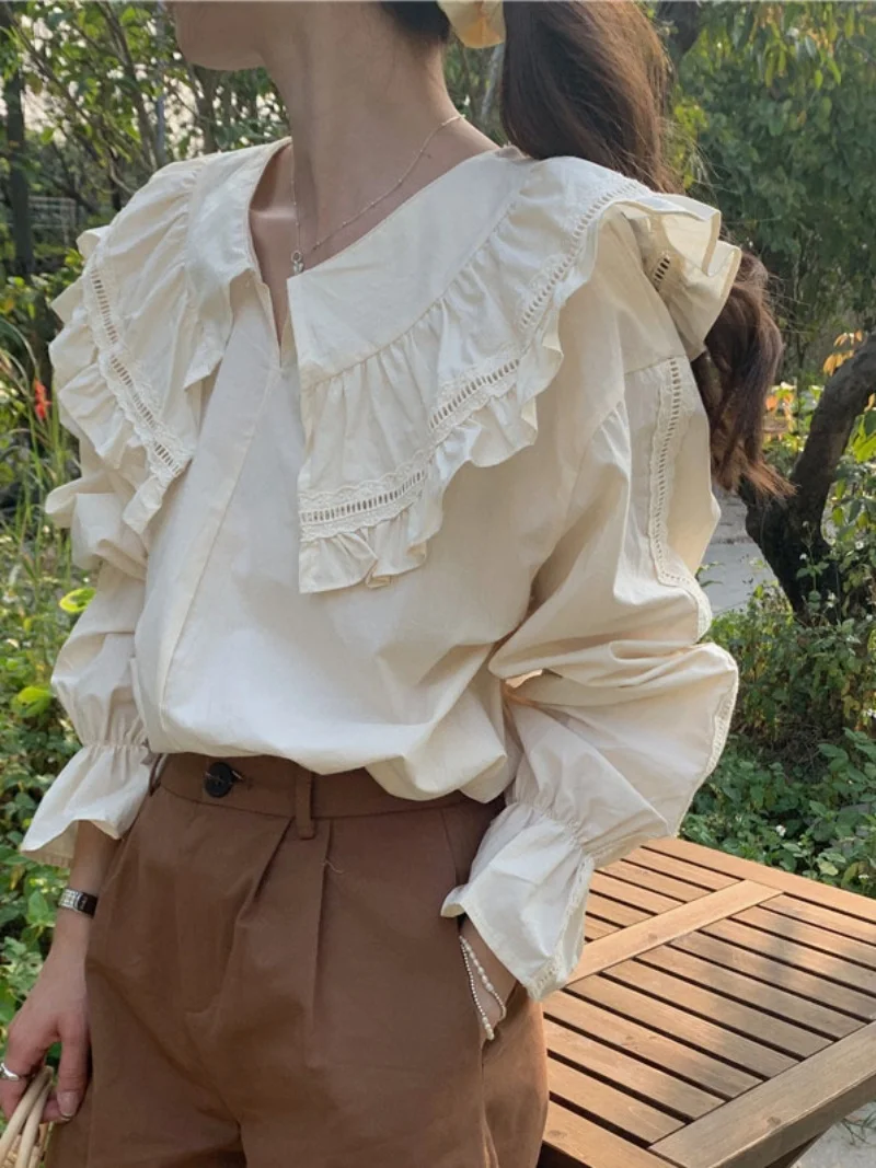 เสื้อแขนยาวทรงหลวมสไตล์เกาหลี คอระบายหวานๆ สำหรับผู้หญิง สีพื้น เหมาะกับฤดูใบไม้ผลิ ดีไซน์เก๋ไก๋ สไตล์ลำลอง แต่งผ้าต่อกัน