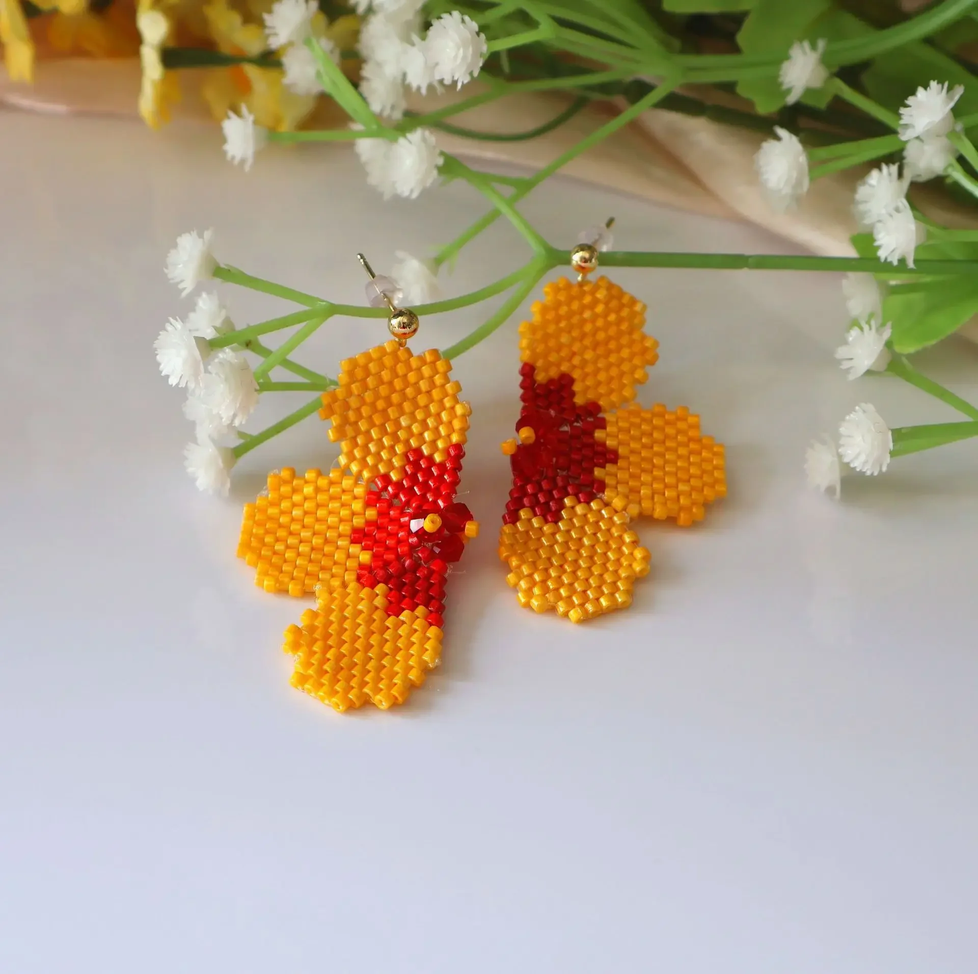 Beaded earrings Yellow flower Symmetry Hand knitting Originality Design Bohemia Alloy Tide Simple Rice bead earrings