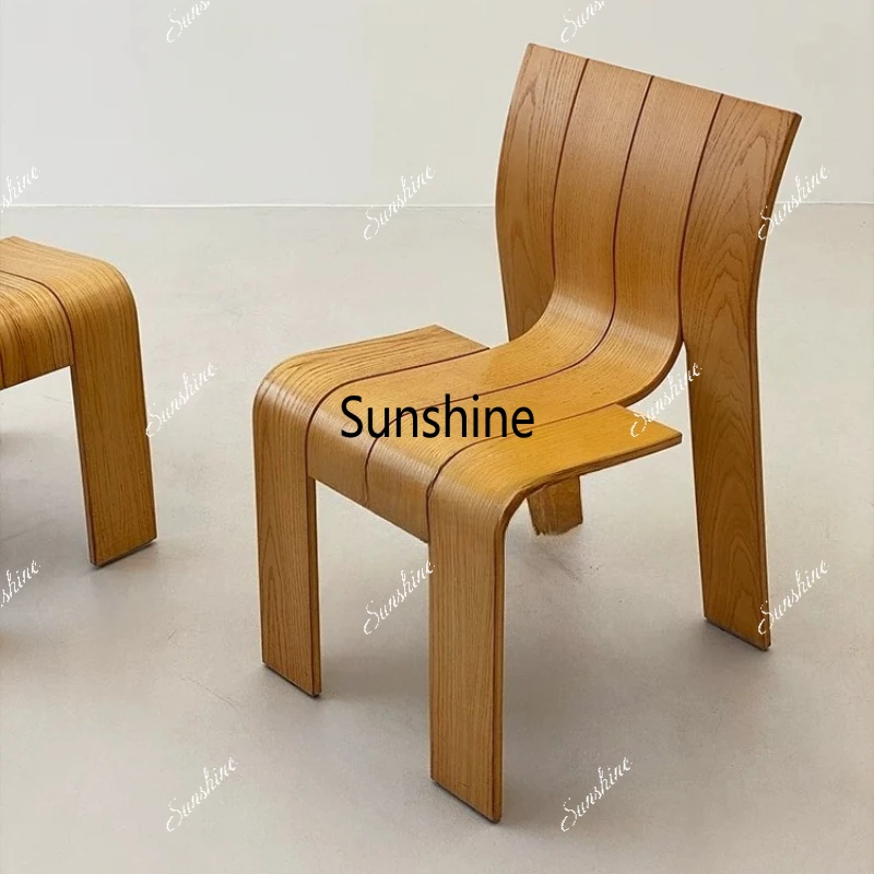 

Minimalist curved wood chair Log dining chair Simple medieval special-shaped dining chair