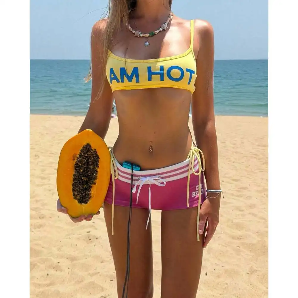 

2026 Summer Leisure Fashion New Beach Spice Girl Style Two-piece Ultra-short suspender vest with navel and sexy hip lift pants.