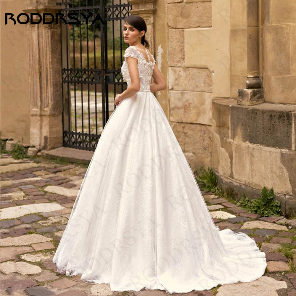 RODDRSYA Vestidos De Novia 3D Flowers Cap Sleeves Wedding Dress Elegant Tulle Bridal Lace A Line O Neck Pearls Belt Bride Gown