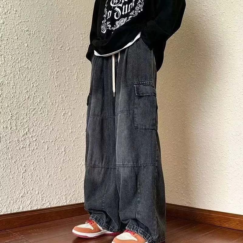 

Chic Women's Ripped Pockets Denim Trousers Loose Low Waist Zipper Wide Leg Jeans Female 2026 Spring High Street Casual Pants New