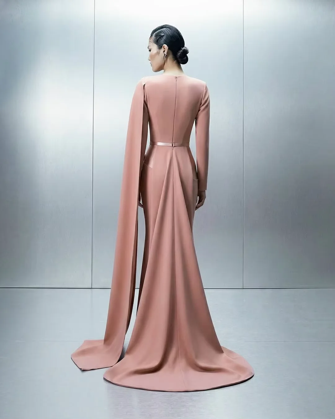 Elegant Blush Pink Satin Gown with Draped Cape Sleeves, Belted Waist & Flowy Floor-Length Silhouette – Lili's Couture Collection