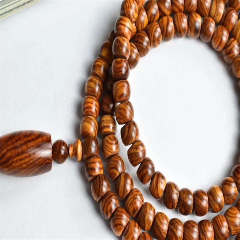 Hainan Huanghuali 108-bead Buddhist made of old wood, unisex face and ghost eye decorative bracelet