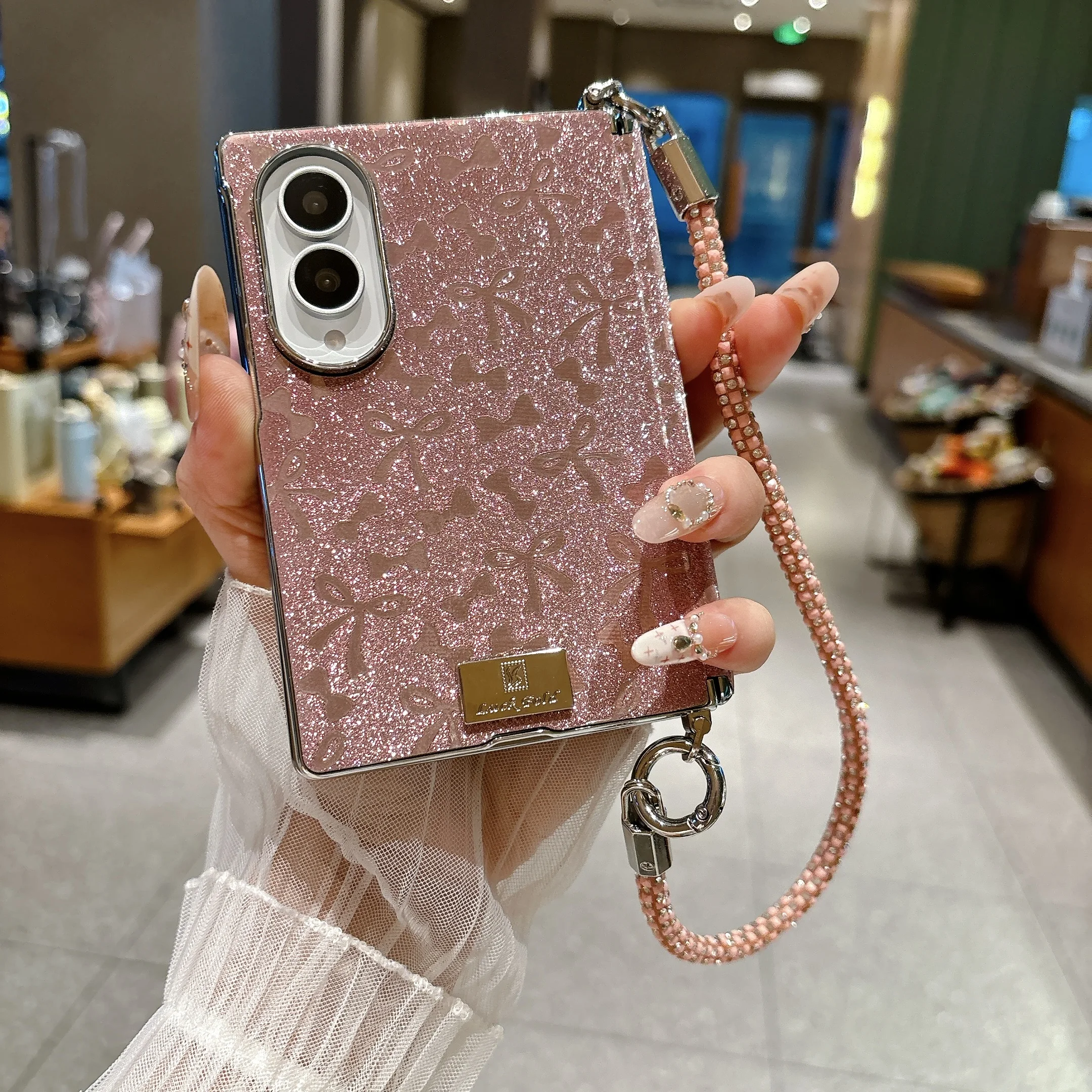 Modische Glitzer-Schleife ‌   Leder-Handyhülle für Samsung Z Fold 8 mit breitem Scharnierschutz, stoßfest, mit Handschlaufe, schlanke Abdeckung