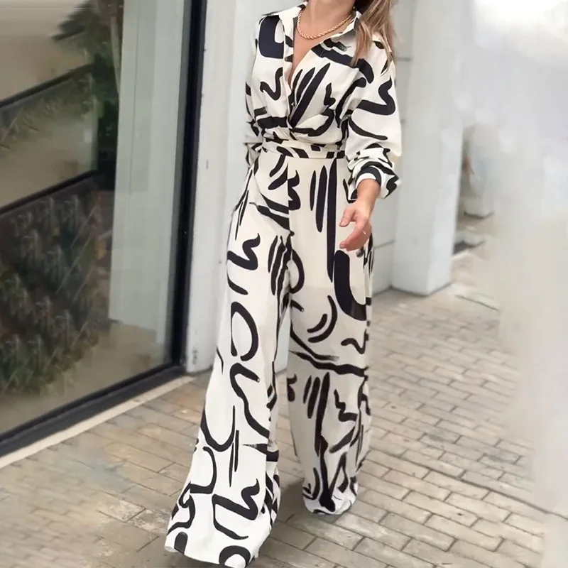 女性の秋のストライプ落書きプリント長袖ミッドレングスカジュアルブラウスジャンプスーツルーズフィットファッションエレガントなロンパース服