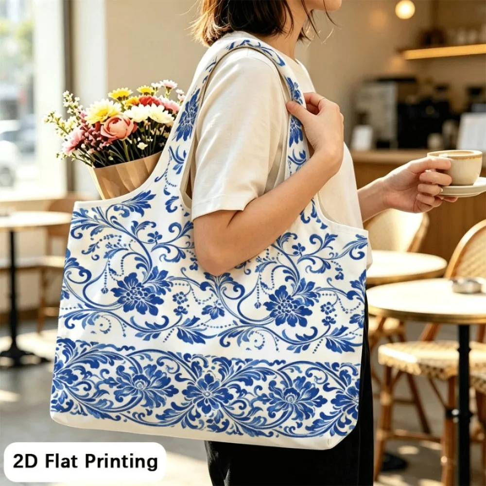 Scrolling vines bear blue blossoms Foldable tote shoulder bag, reliable for frequent outings.