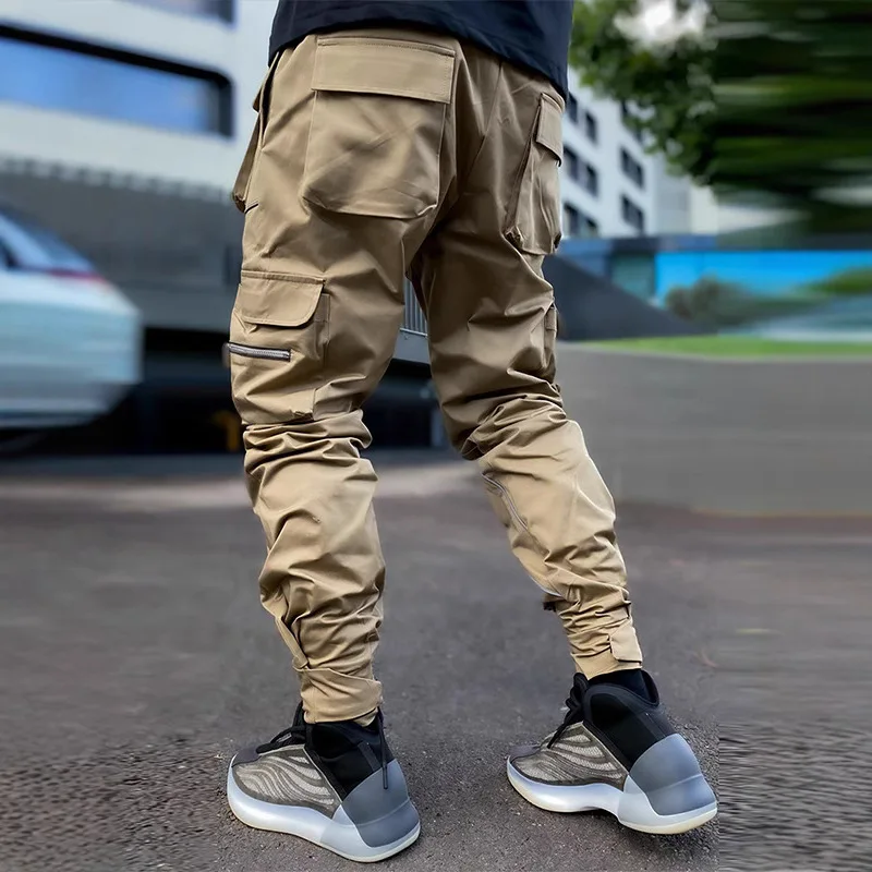 カスタムロゴ入りメンズ春秋カジュアルパンツ、ユースオーバーオール、多ポケット、スリムフィット、ベルクロ付きトラウザーズ