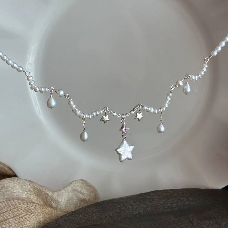 

Vintage-style star pearl tassel necklace. European/American design, perfect for sweaters.