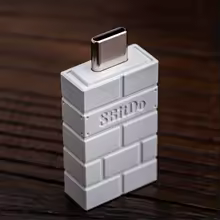 Adaptador USB-C sem fio da marca 8BitDo com design texturizado de tijolos