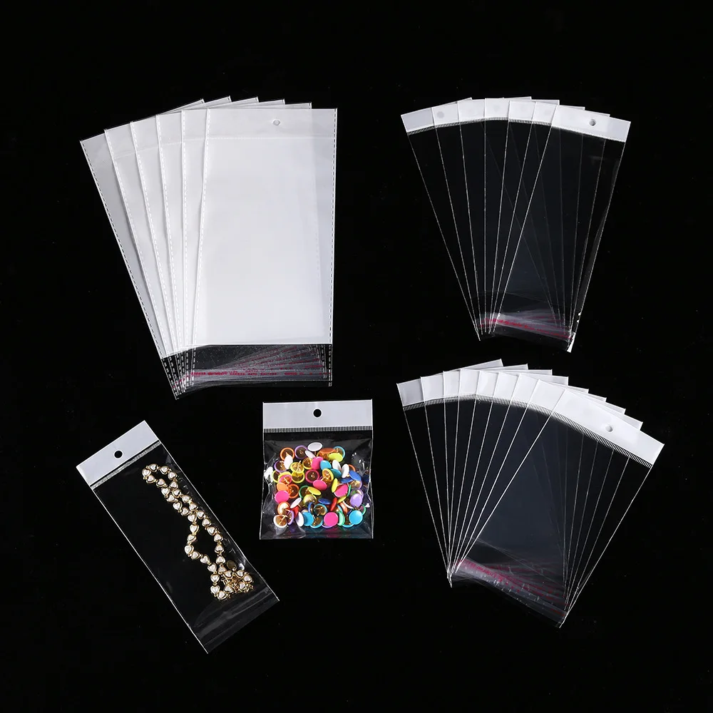 

100 шт. прозрачные подвесные сумки для ювелирных изделий, закрывающаяся сумка, самозапечатывающаяся сумка с отверстием для упаковки ожерелий, сережек, ювелирных изделий