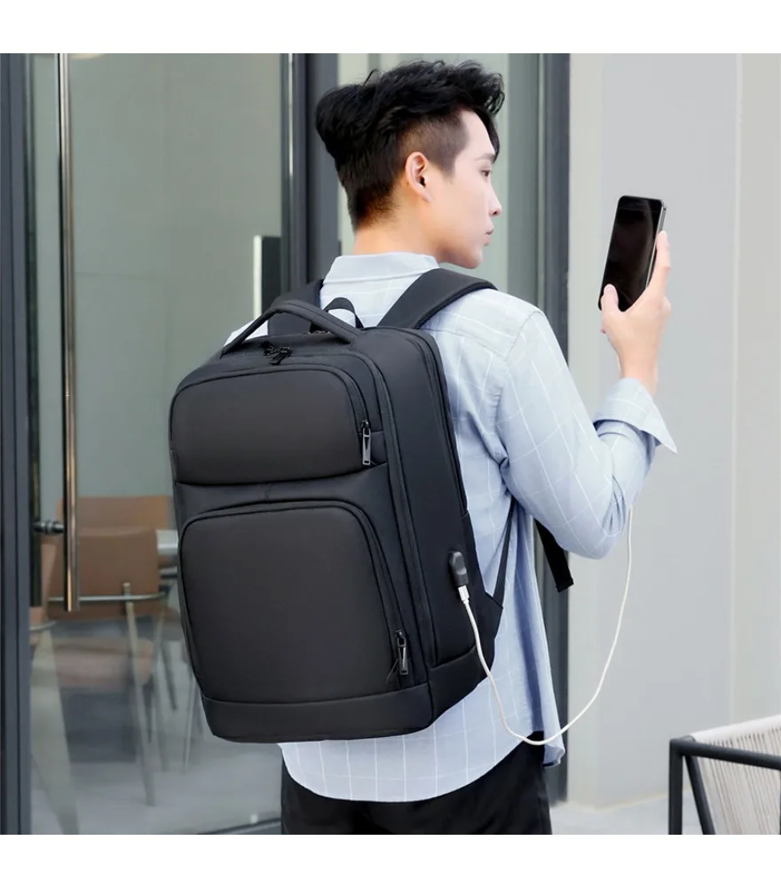 Black multi compartment backpack dual front slip pockets side mesh pockets reinforced base water resistant material suitable
