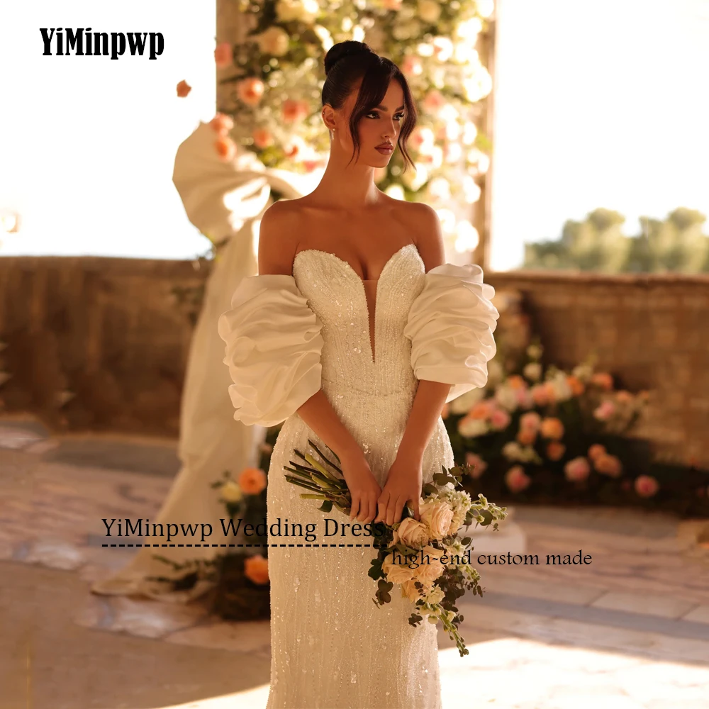 ビーズの高級ウェディングドレスの女性ノースリーブマーメイド花嫁ドレスプリーツ恋人ブライダルドレスvestidosデノビアカスタマイズBeadeing豪華な結婚式のドレスの女性の袖レスの美人魚の花嫁のガウンプリーツの愛の心の花嫁のドレス vestidos de noviaカスタマイズされた