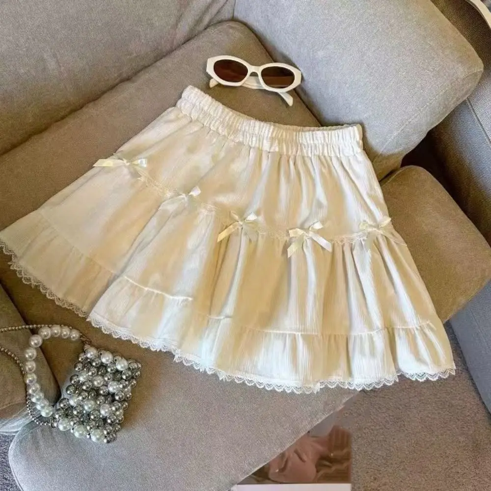 Minigonna corta da ragazza a vita alta con pantaloni di sicurezza Gonna a trapezio con fiocco con volant Abito da torta Minigonne a pieghe in pizzo allentato Lady