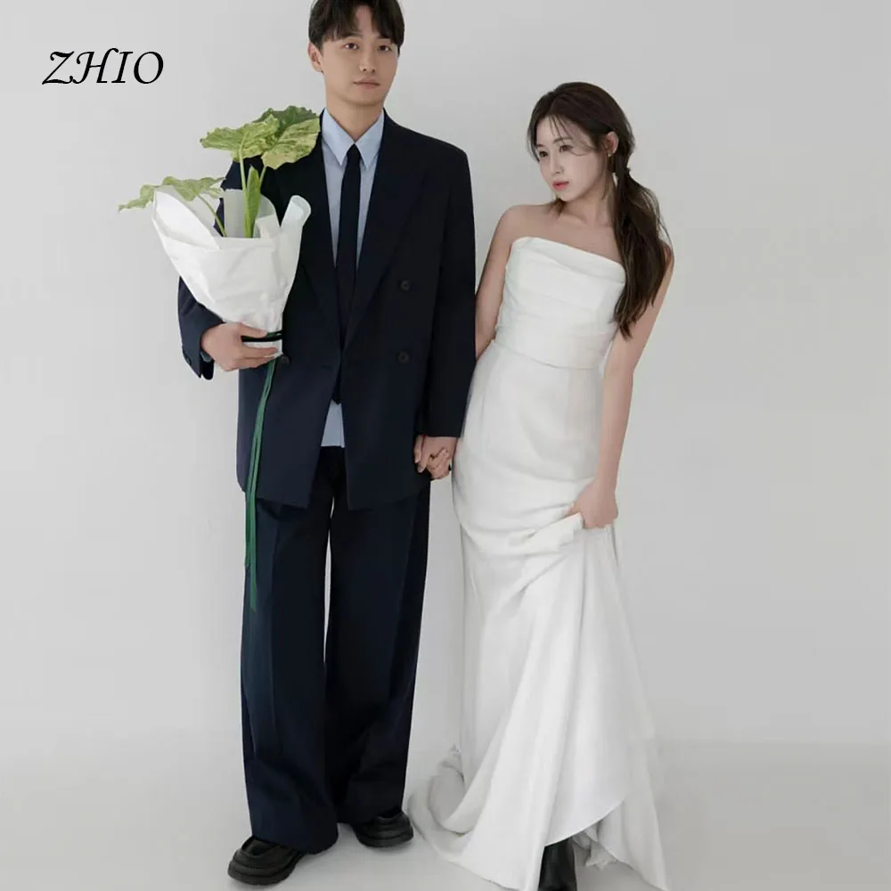 ชุดแต่งงานสีขาวเรียบง่ายแบบ ZHIO สายเดี่ยวทรงคอร์เซ็ท ทรงเอไลน์ ชายกระโปรงยาวแบบสวีปเทรน สไตล์เกาหลี สำหรับถ่ายภาพงานแต่งงานและงานเลี้ยงฉลอง สามารถสั่งตัดได้