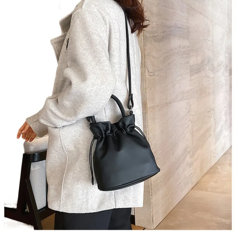 

Japanese mini drawstring bucket bag hundred ins simple handheld shoulder bag tide student crossbody bag female
