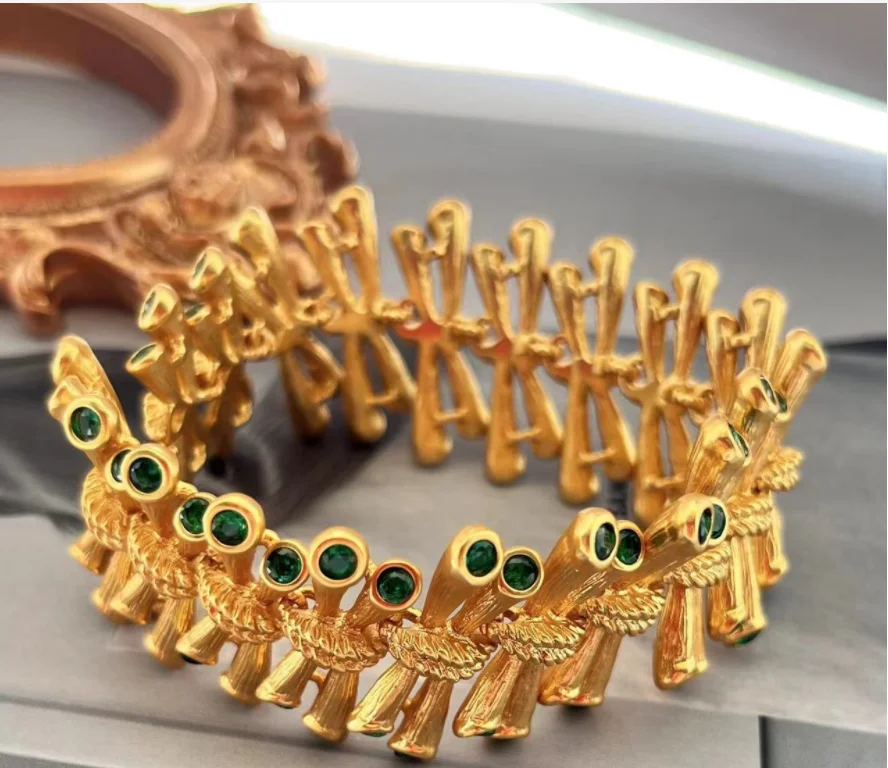 

Ancient bracelet copper plated gold inlaid with green zircon