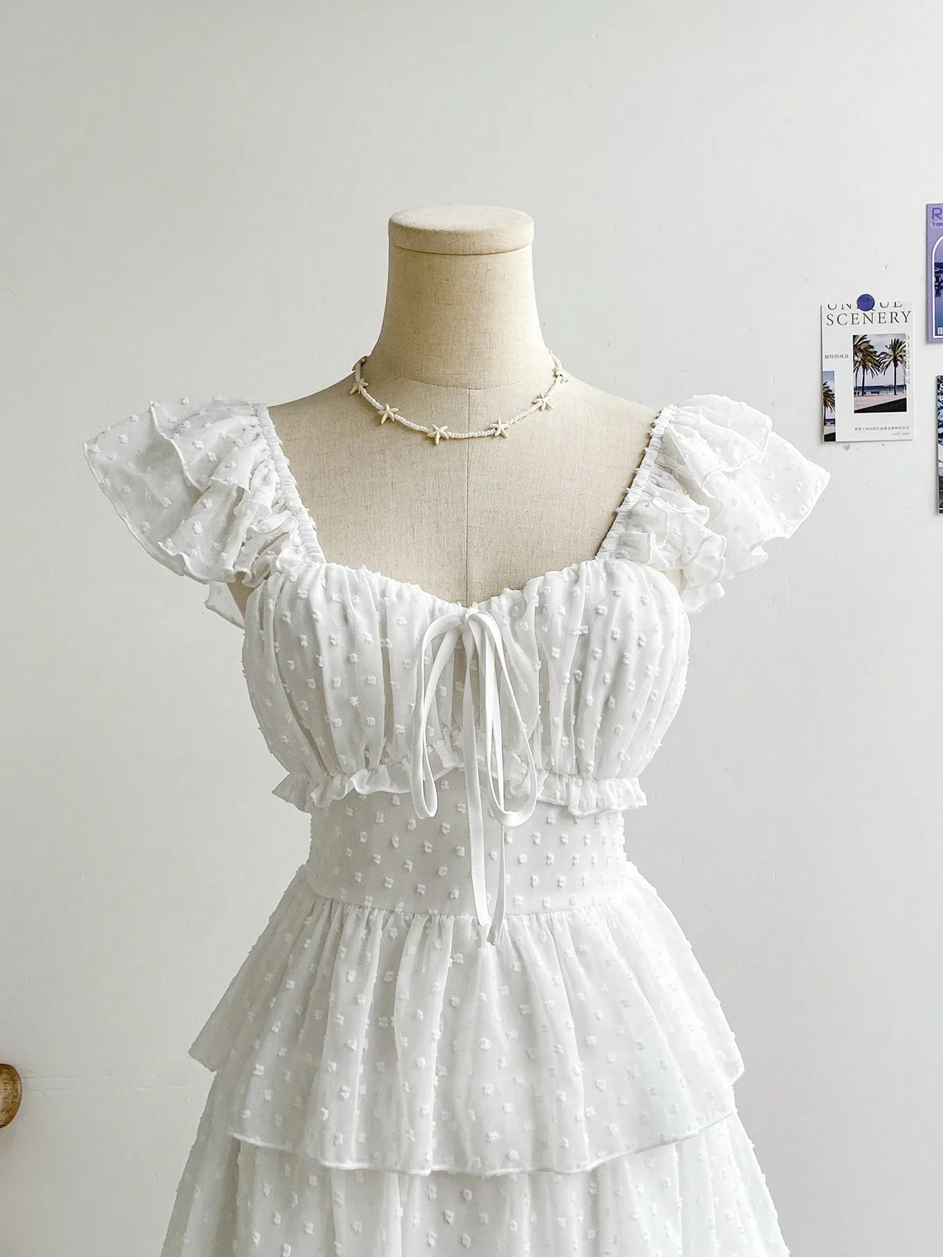 

Romantic Ruffled Tiered Mini Dress With Bow Tie Front And Puff Sleeves
