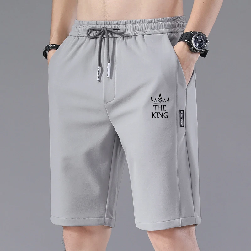 Pantalones cortos deportivos con cintura elástica para hombre, pantalones cortos de playa de cinco puntos, pantalones cortos informales suaves para correr