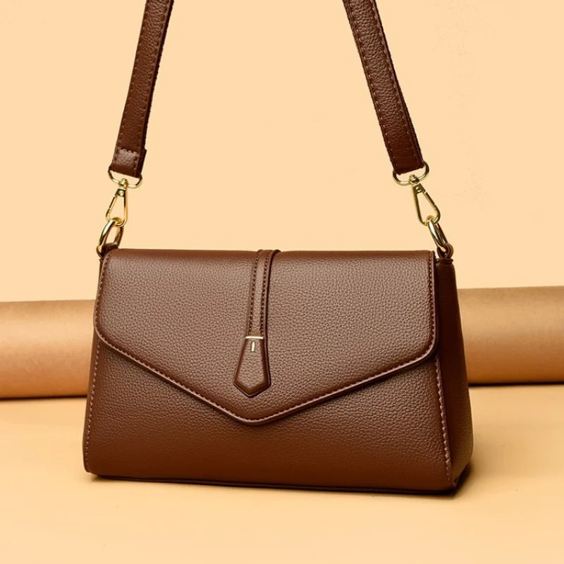 

Женская элегантная кожаная сумка через плечо из роскошного бренда с логотипом известного дизайнера и простым винтажным стилем ​