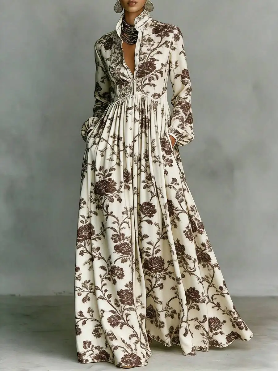 

Cream Base Brown Floral Print Long Sleeve Maxi Dress With Stand Collar, Button Front, And Pleated Waist For Casual Party Wear