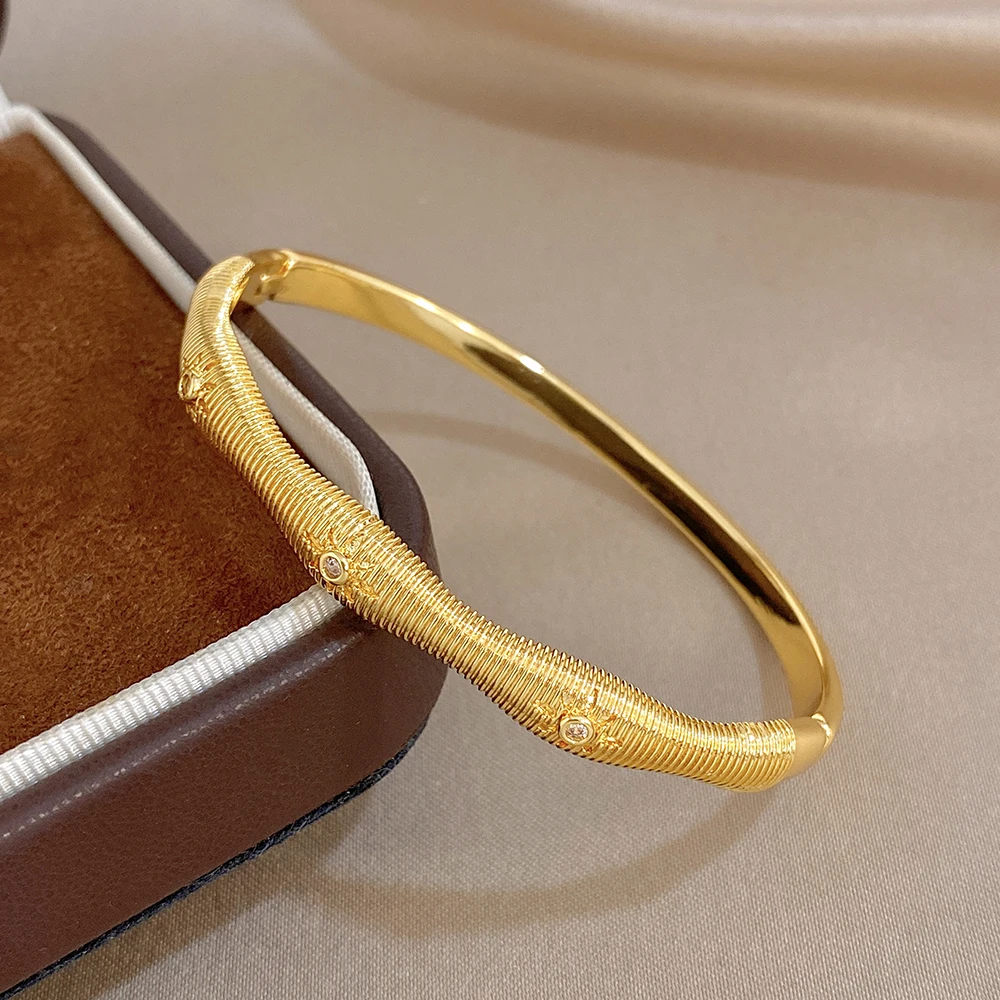 

Modern Irregular Fine Striped Gold Plated Copper Bangle for Women Glossy Rhinestone Inlaid Spring Bracelet Hand Jewelry Gift