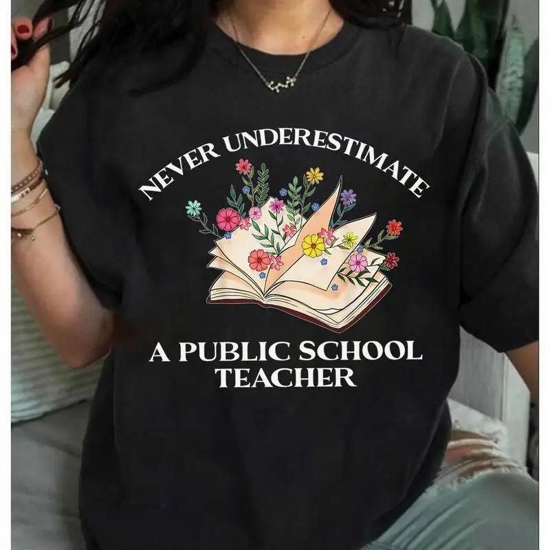 

Public School Teacher T-Shirt. Never Underestimate Graphic Tee. Floral Book Print Top. Teacher Appreciation Gift. Education Hero