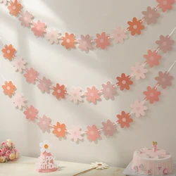 Gradient daisies pull the banner to decorate the holiday party decorations