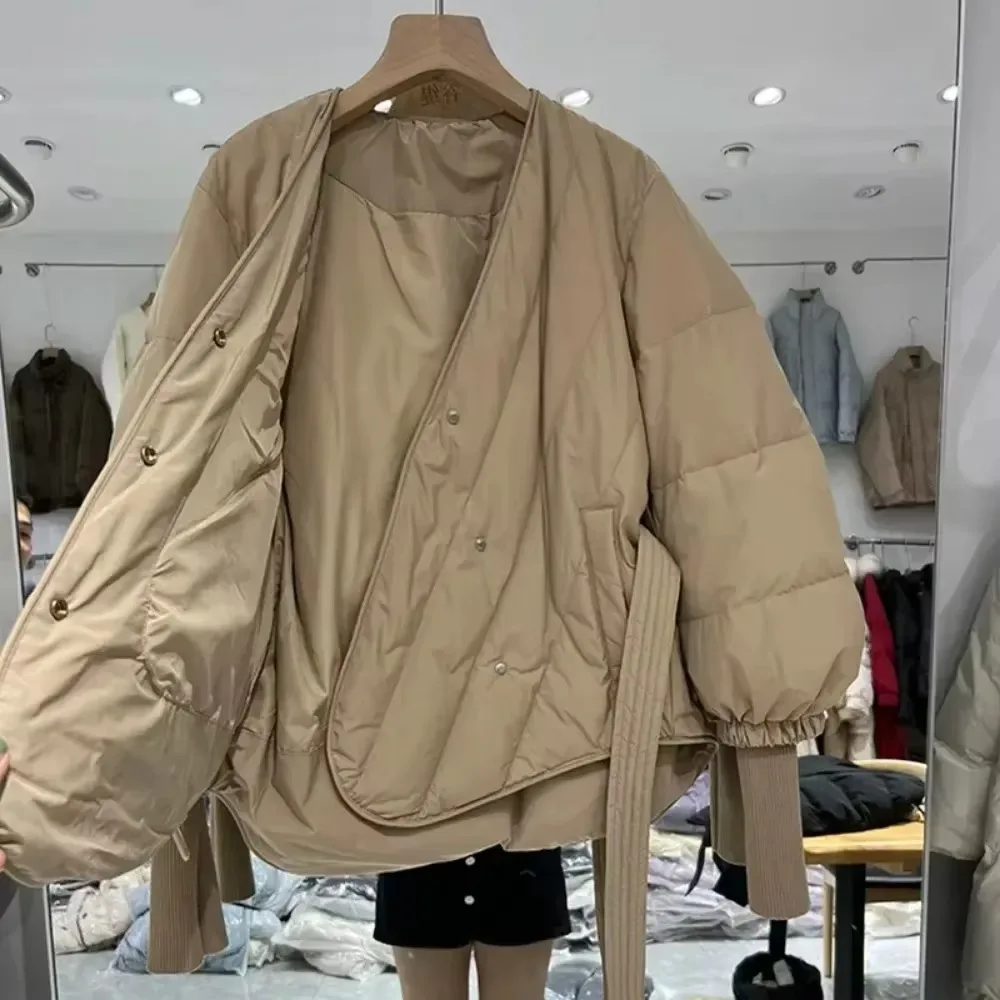 2024 novo inverno feminino design de luxo quente puffer jaqueta feminina 90% pato branco para baixo casaco com cinto fino com decote em v outwear
