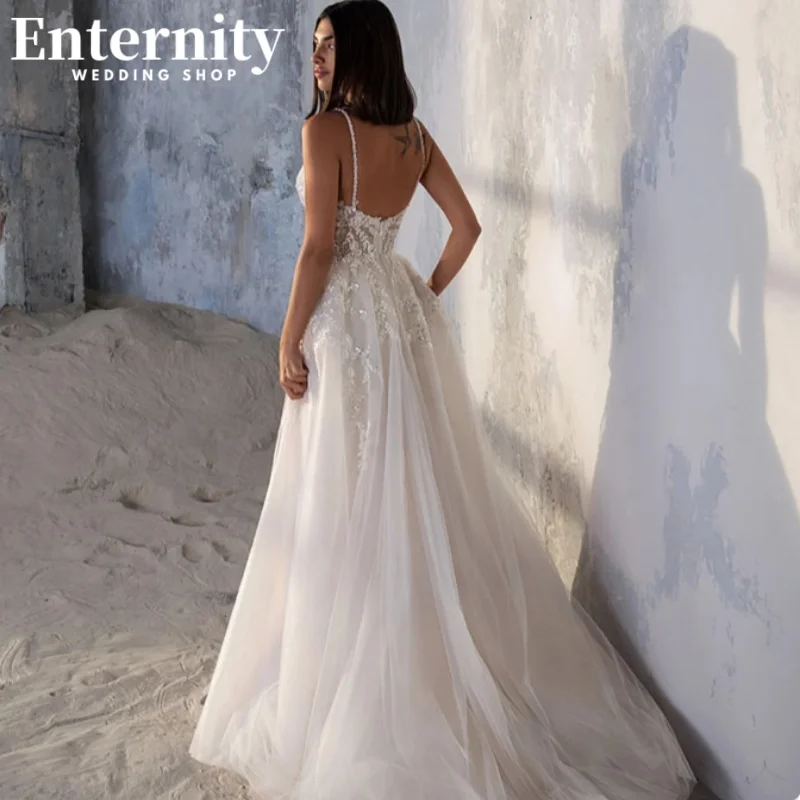 Customized Lace Appliqued Wedding A-line Dress Side Slit Backless Spaghetti Straps Sleeveless Beach Robe Customized Gowns