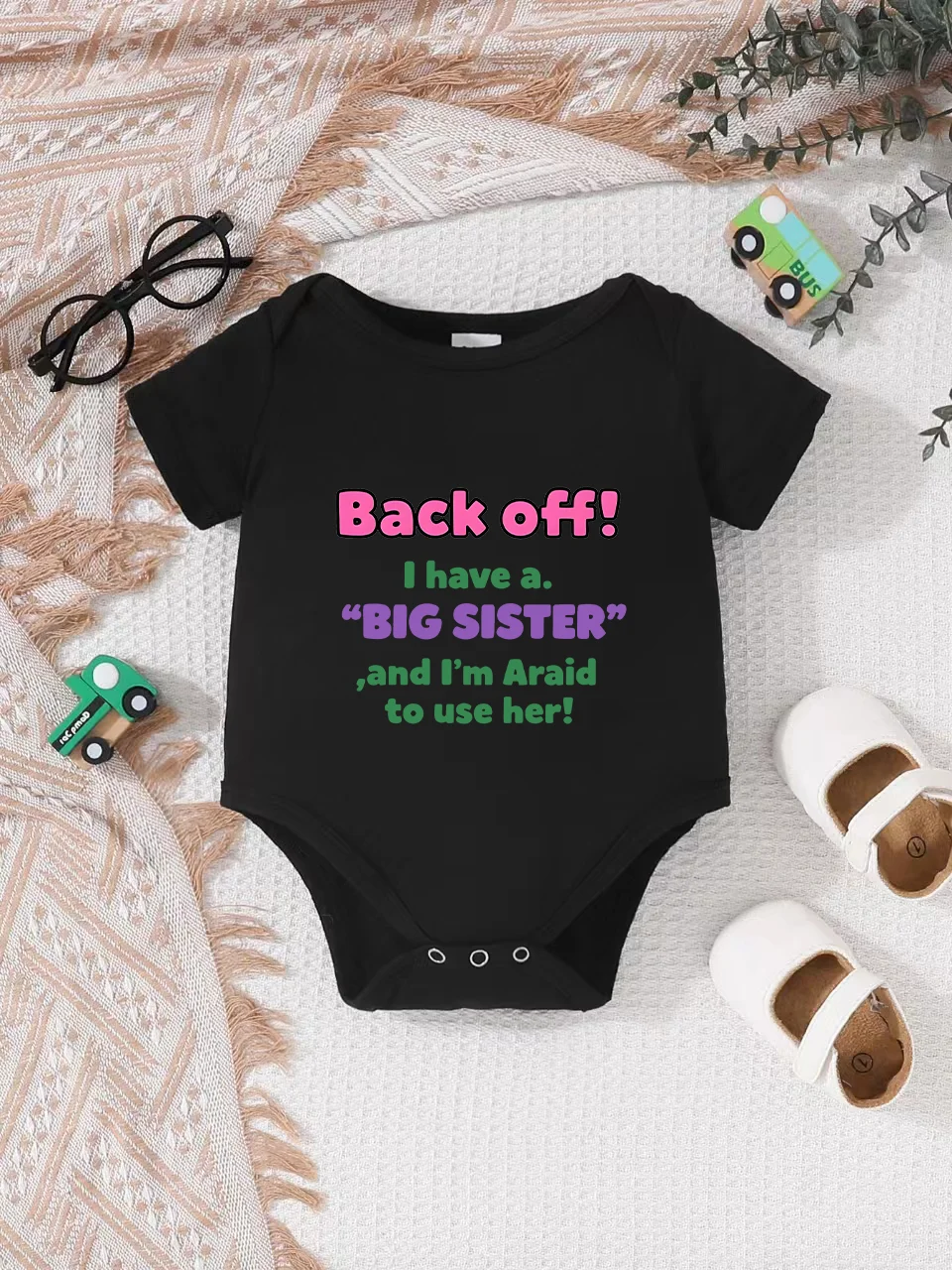 

Playful letter-printed baby short-sleeve triangle bodysuit. Button closure for easy dressing