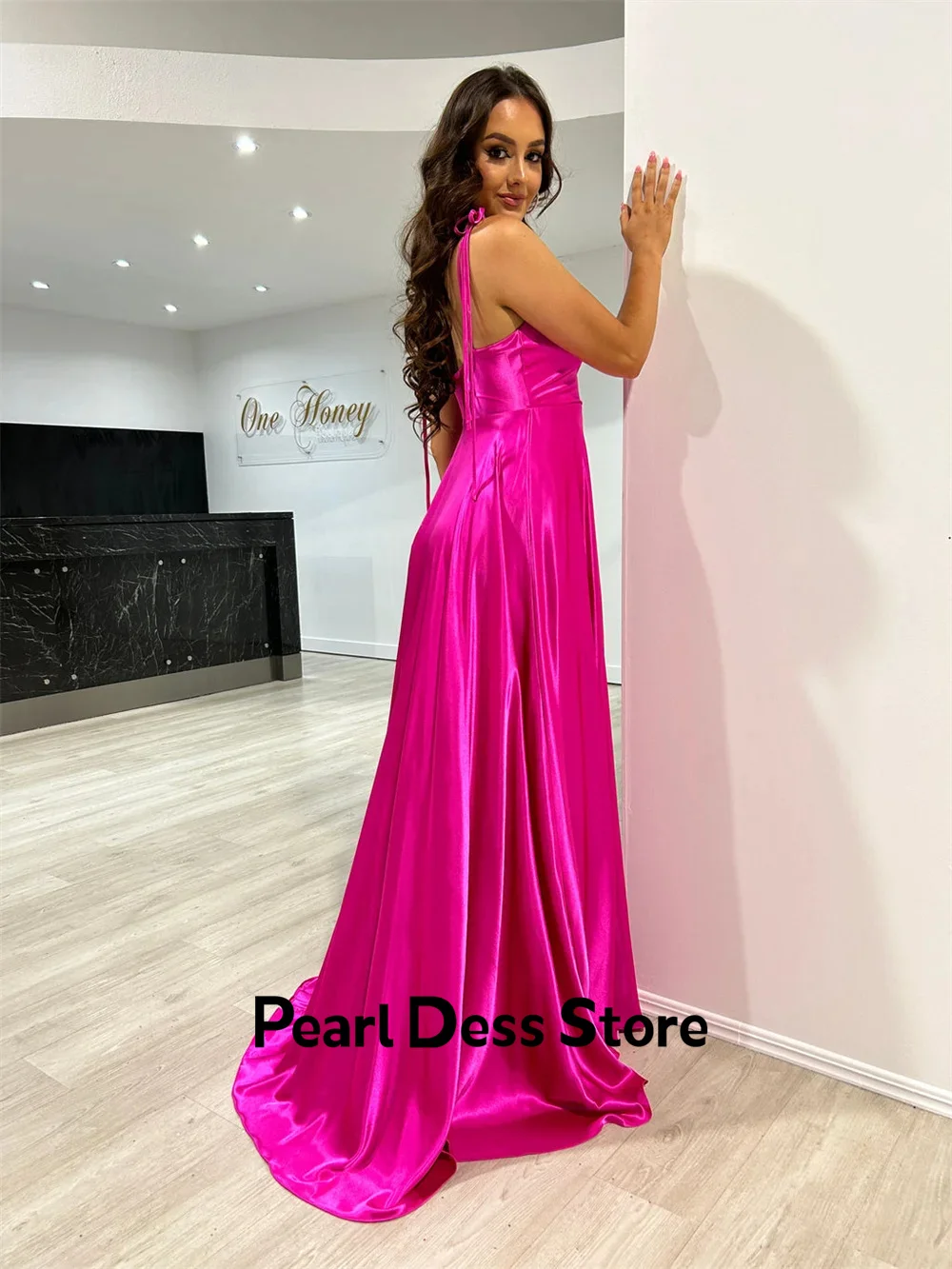 Minimalist satin evening dress with thin shoulder straps and purple red side slits. Customized ball dress for special occasions