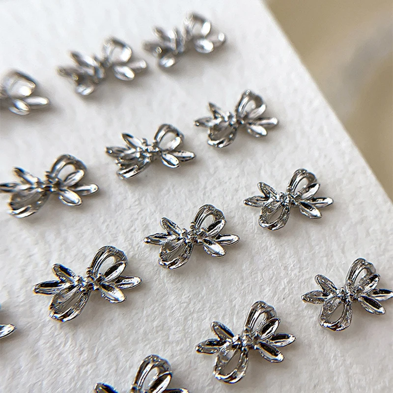 20 piezas de aleación de plata con lazo para uñas, cinta de lujo, alas de mariposa, diamantes de imitación de Metal para decoración de uñas, accesorios de manicura