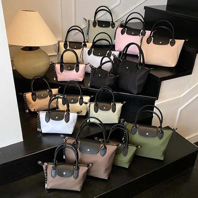 

New 2025 Casual Commuting Bag, Lightweight Nylon Fabric Crossbody Phone Bag, Niche Mini Hand-held Dumpling Bag