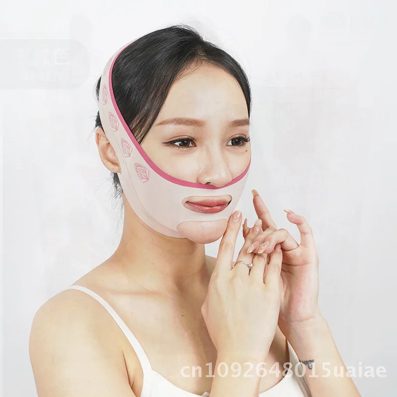 Maschera per bendaggi per il rafforzamento rapido con sollevamento a V per modellare il viso, bordo rosso rosa, intaglio, massaggiatore per giorno e notte senza soluzione di continuità, strumento di bellezza per il viso