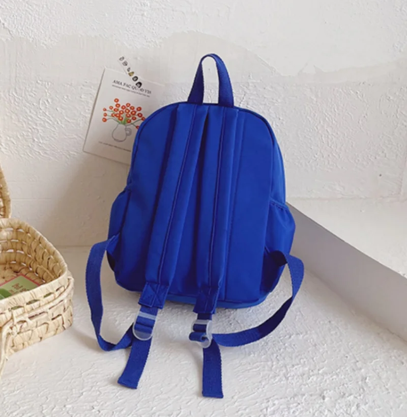 Mochila ligera con bordado de nombre para estudiantes, bolso escolar pequeño y fresco con contraste de Color, venta al por mayor, nuevo