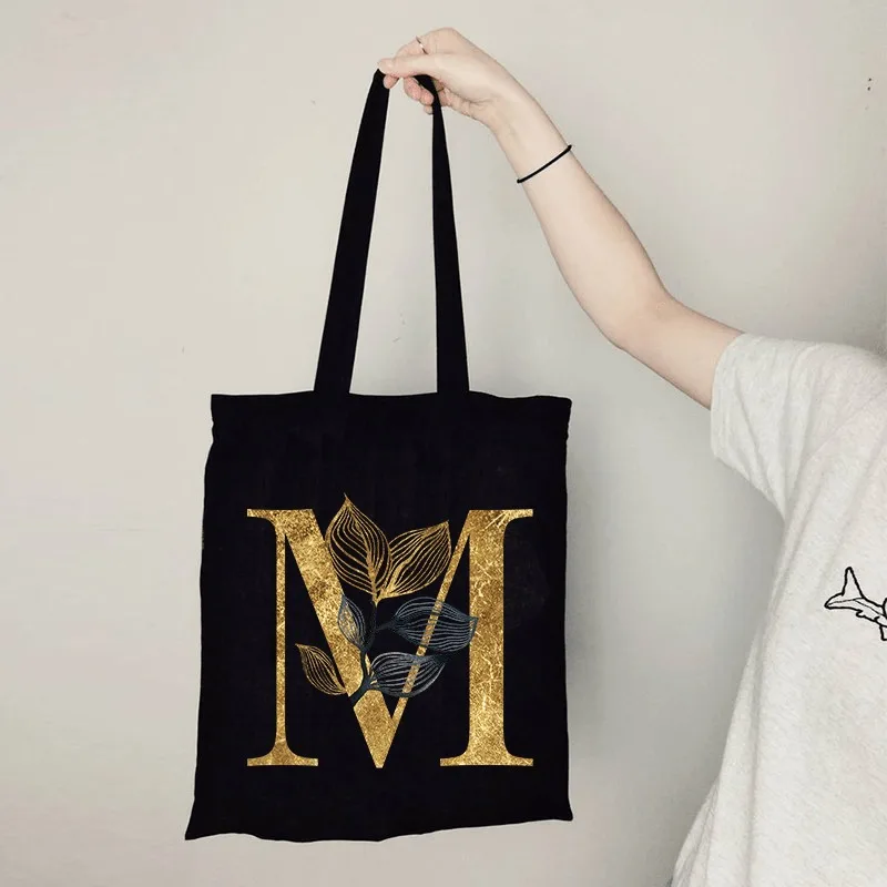 

Элегантная черная парусиновая сумка через плечо с золотым узором в виде листьев, подходящая для женской повседневной и универсальной повседневной носки