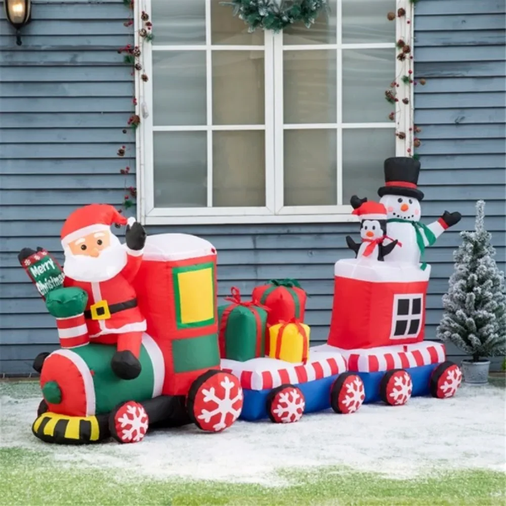 Santa Claus, Snowman and Penguin carry gift boxes on train inflatables, putting together a cohesive Christmas display LED lights