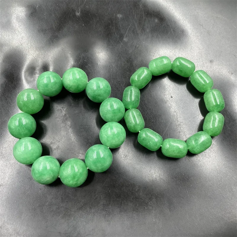 White background with tube beads , emerald green 20mm jadeite bracelet
