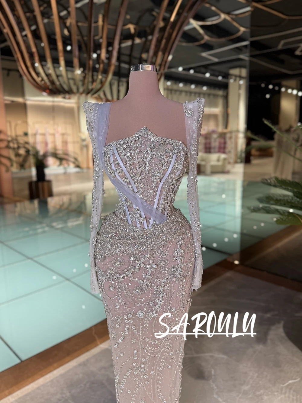 

Elegant Shiny Nude Mermaid Prom Dress Full Crystal Beaded See Through Long Sleeve Cross Strap Formal Evening Gown For Gala